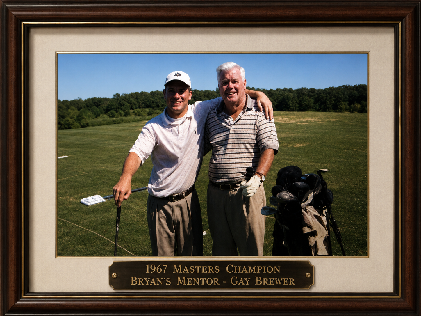 Bryan Conway with his mentor Gay Brewer, 1967 Masters Champion, at a driving range